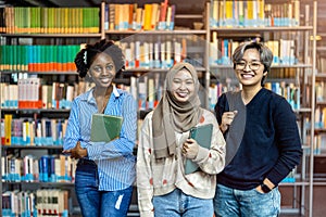 Group of diverse students standing together in a library