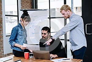 Group of diverse young creative business people discussing new business project in office. Business people and Communication