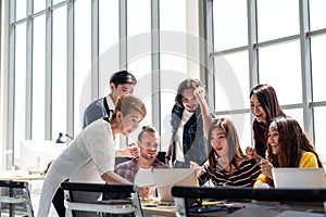 Group of Diversity People Team smiling and excited in success work with laptop at modern office. photo