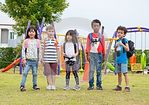 Group of diversity school children playing at playground in kind
