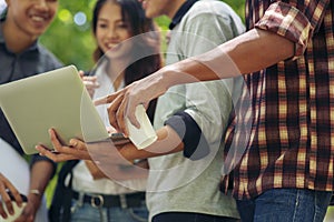 Group of Diversity Student working on laptop together at university,Happy multi ethnic friend successfully completes the thesis