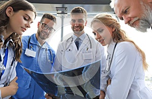 Group of doctors checking x-rays in a hospital