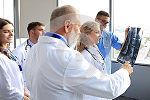 Group of doctors checking x-rays in a hospital