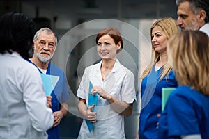 Group of doctors on conference, medical team discussing issues.