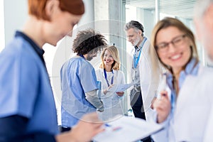 Group of doctors on conference, medical team discussing issues.