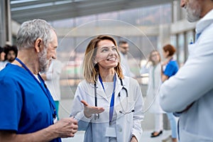 Group of doctors on conference, medical team discussing issues.