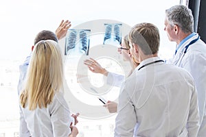 Group of doctors discuss x-ray