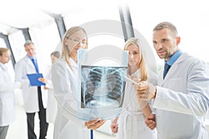 Group of doctors discuss x-ray