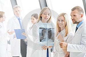 Group of doctors discuss x-ray