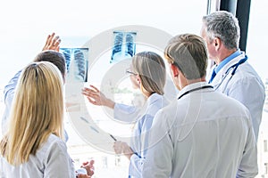 Group of doctors discuss x-ray