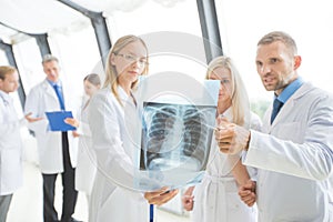 Group of doctors discuss x-ray