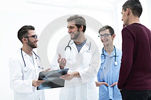 Group of doctors discussing a patient`s x-ray