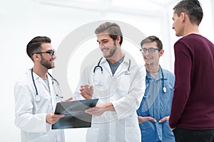 Group of doctors discussing a patient`s x-ray