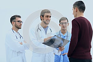 Group of doctors discussing a patient`s x-ray