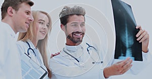 A group of doctors examining an x-ray in the hospital