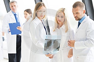 Group of doctors looking at x-ray