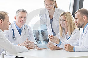 Group of doctors looking at x-ray