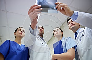 Group of doctors looking at x-ray scan image