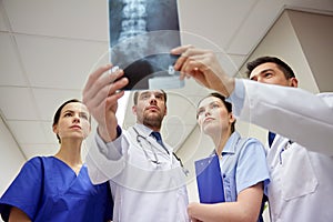 Group of doctors looking at x-ray scan image