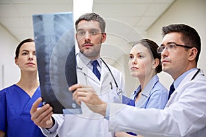 Group of doctors looking at x-ray scan image