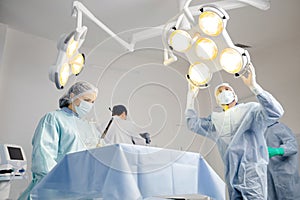 Group of doctors performing surgery in hospital