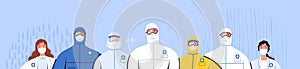 Group of doctors in protective suits, glasses and medical masks are standing next to each other. The concept of the
