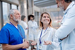 Group of doctors talking during conference. Medical networking. Medical experts attending an education event, seminar in