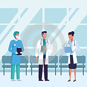 Group of doctors wearing medical masks inside of waitroom