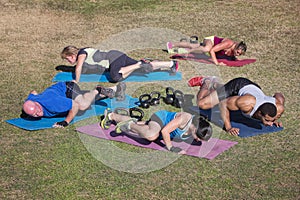 Group Doing Knee Elbow Exercises