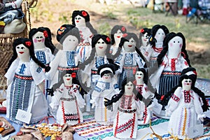 Group of doll women and girls in traditional Moldovan clothes