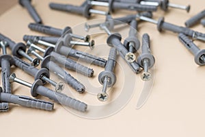 a group of dowels and nails on a yellow background