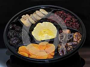 Group of dried fruit for Tu Bishvat holiday . Apricot, fig, palm, and plum, blueberry and pineapple