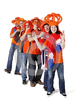 Group of Dutch soccer fans making polonaise over white background