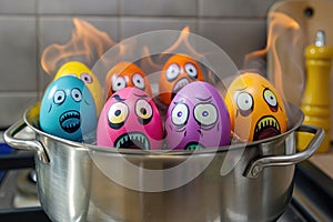 Group of Easter colored eggs with dramatic faces in a pot, with flames behind