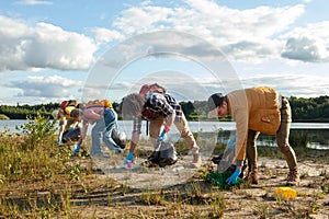 Group Effort in Lakeside Cleanup by Eco-Conscious Volunteers