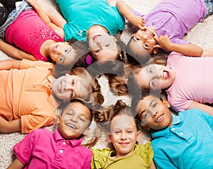 Group of eight happy kids in star shape