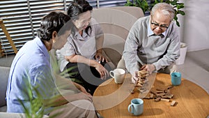 Group of elderly people enjoy talking , relaxing with game at  senior healthcare center