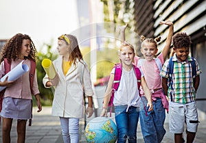 Group of elementary age schoolchildren outside School time