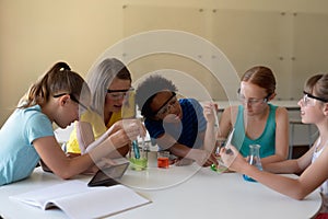 Group of elementary school kids in chemistry class