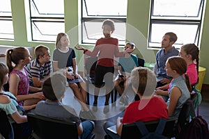 Group of elementary school kids sitting in a circle