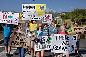 Group of elementary school pupils walking on a protest march