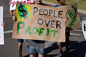 Group of elementary school pupils walking on a protest march