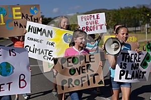 Group of elementary school pupils walking on a protest march