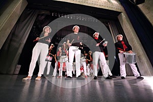 A group of eleven people in the same costumes photo