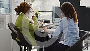 Group of employees analyzing statistics on documents