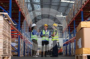 Group of employees in an auto parts warehouse, Examine auto parts that are ready to be shipped to the automobile assembly