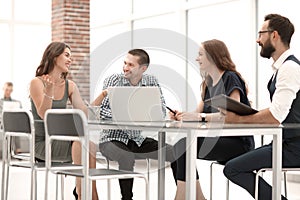 Group of employees discusses new ideas at a working meeting