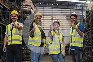 Group of employees and engineers in industrial plants. Team of workers and engineer showing thumb up in Factory at production