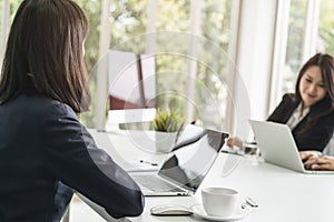 Group of employees meeting and discussing in conference room to share ideas