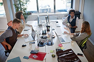 Group of employees talking, working, exchanging opinions and information in modern office. business, modern, casual,  concept